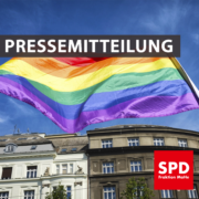 Bild einer wehenden Regenbogenflagge. Text: "Pressemitteilung"